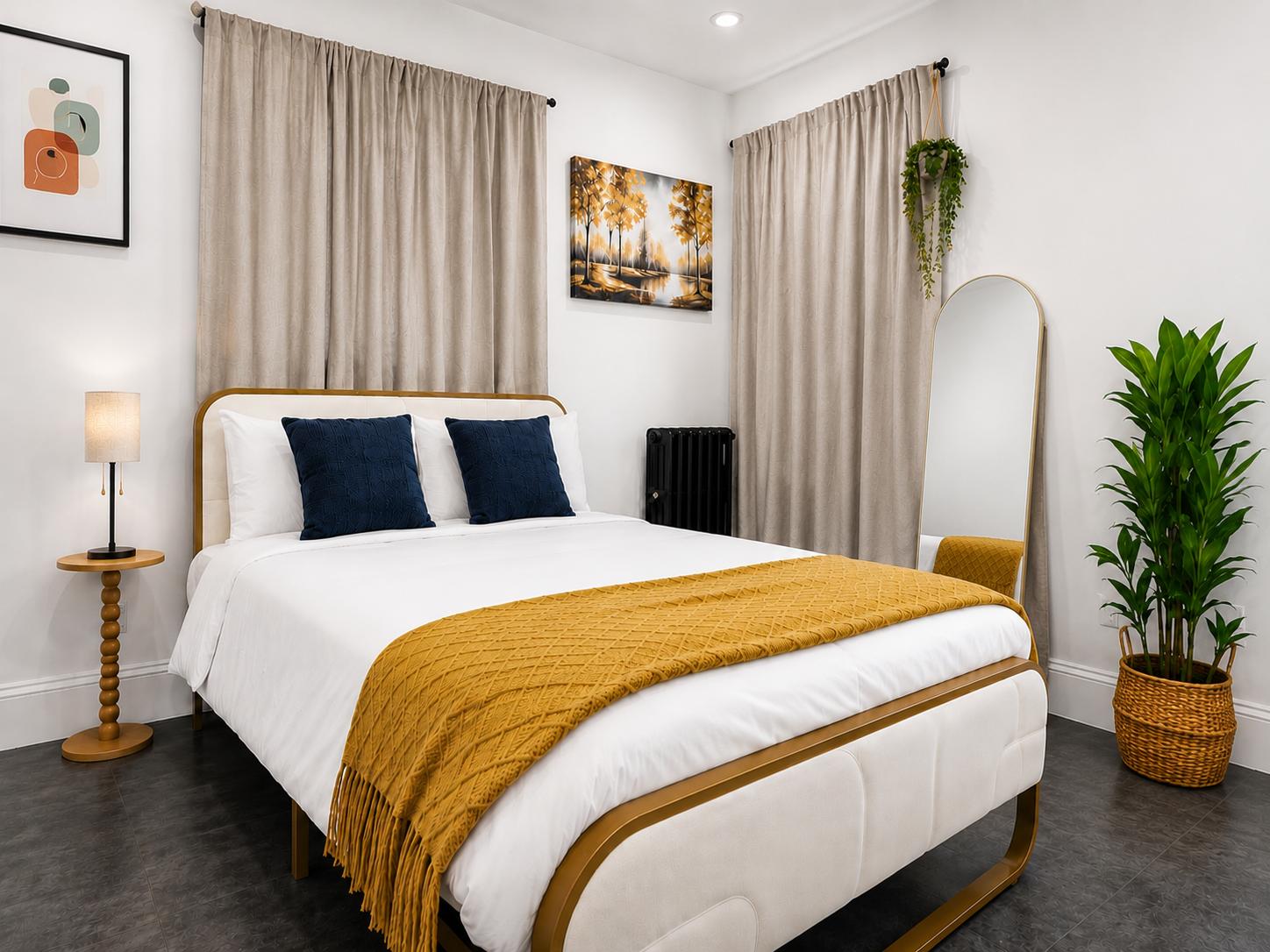 Havrenza Room Four with a bright bed and warm gold accents